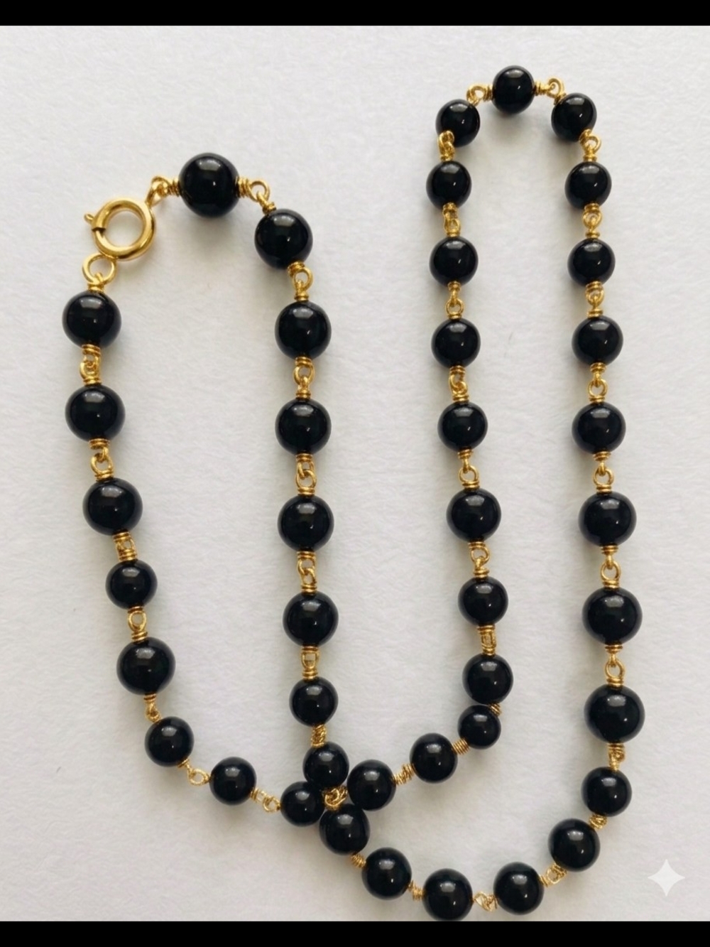 Elegant Black Bead Necklace with Gold Accents